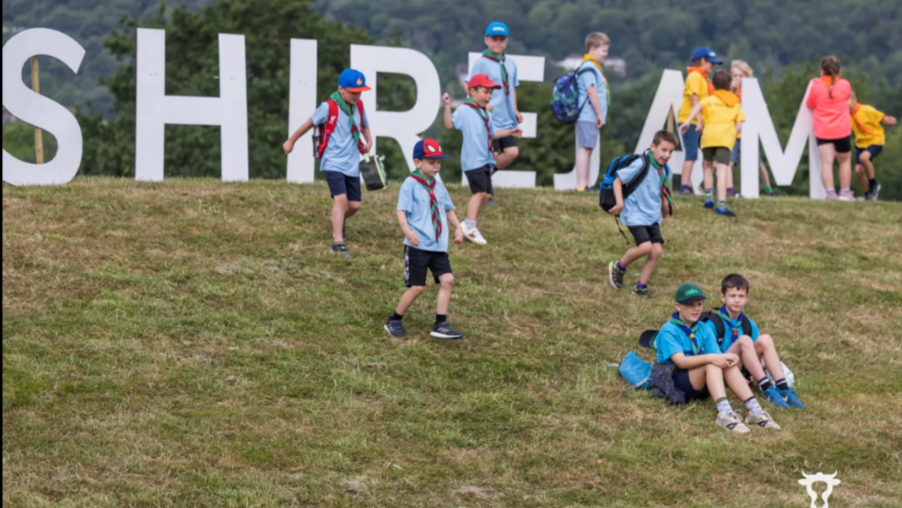 Scouts on field near Shirejam sign